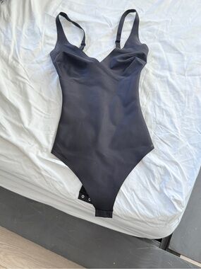 SKIMS Black One-Piece Bodysuit with Adjustable Straps